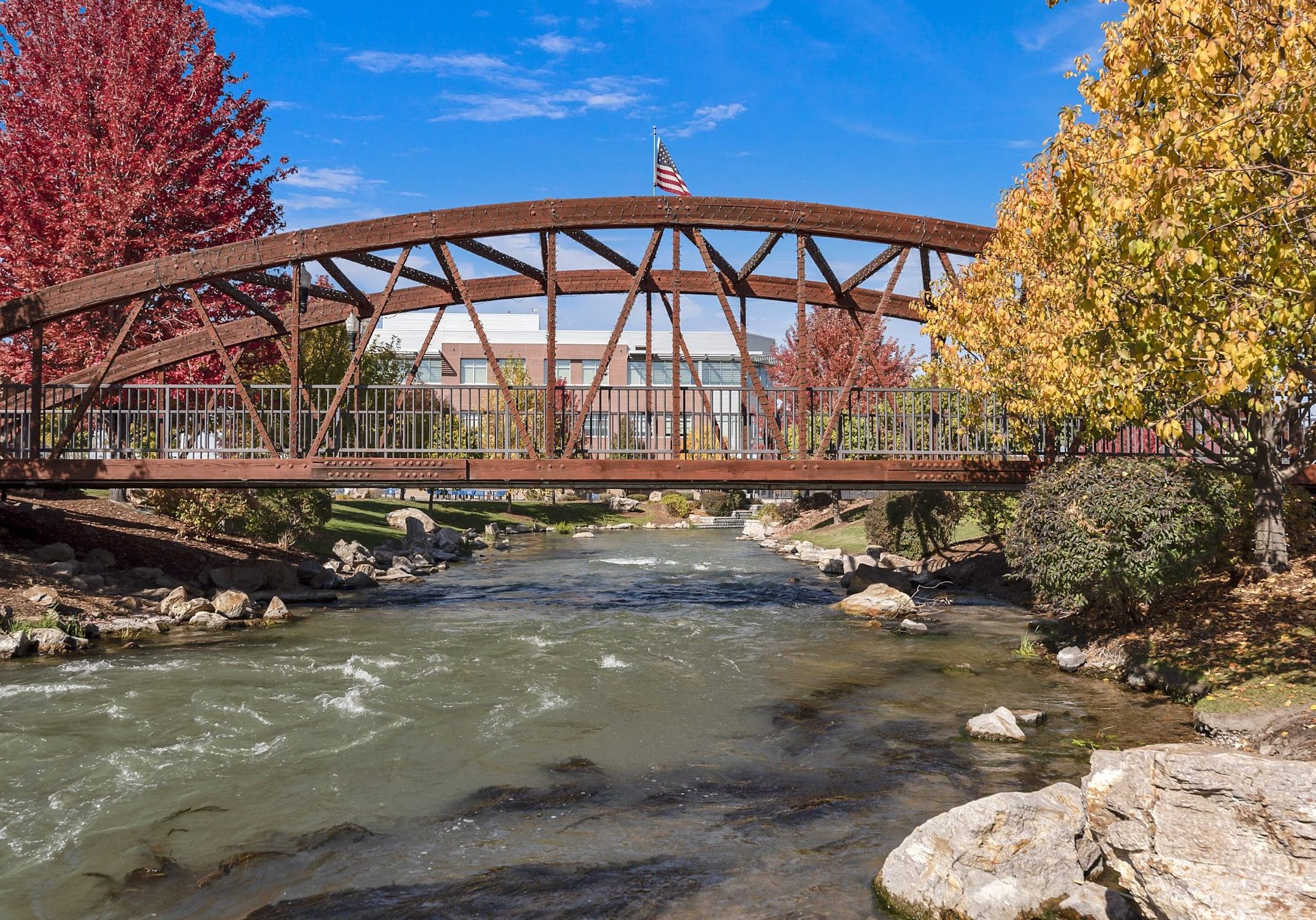 Red metal bridge over Indian Creek in downtown Caldwell, Idaho